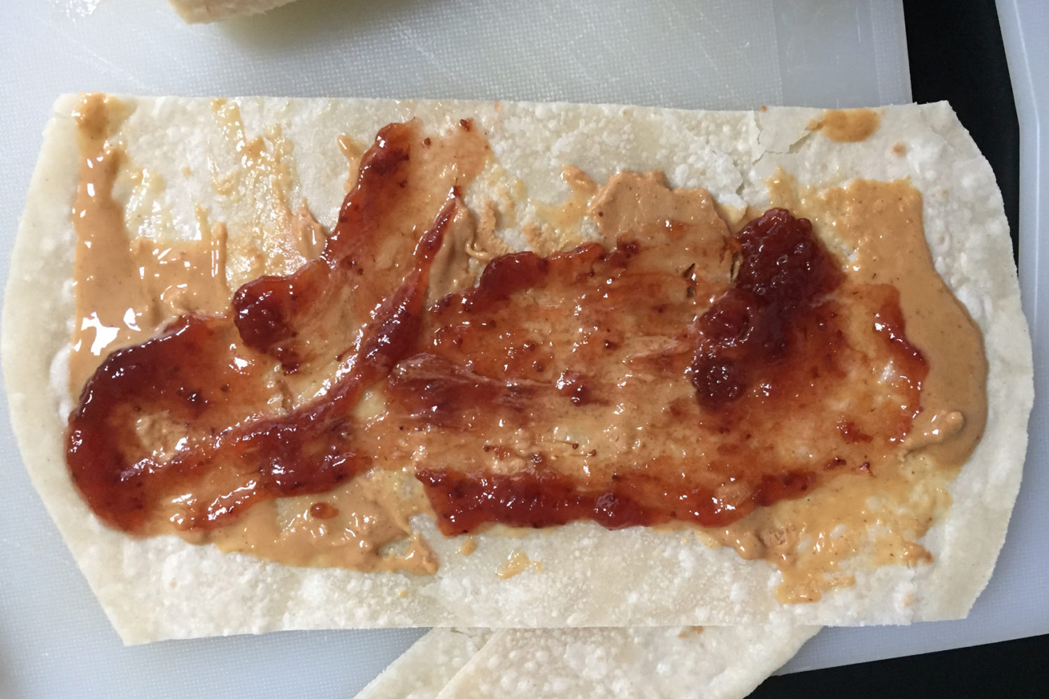 Peanut butter and jelly brown rice tortilla breakfast wrap