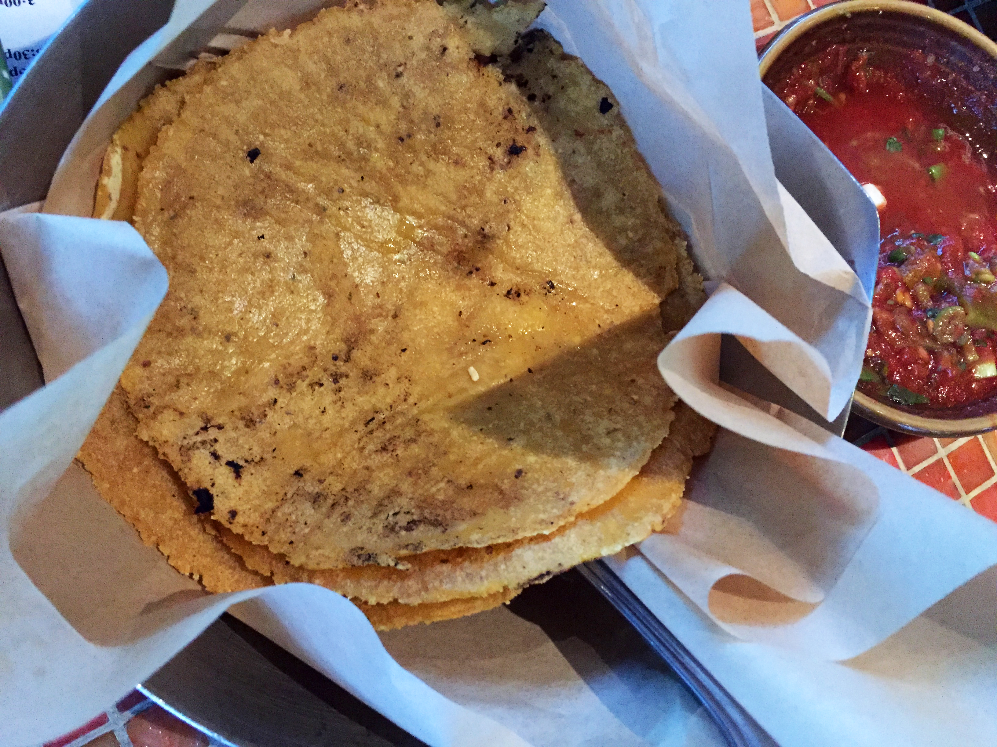 handmade tortillas with fresh red salsa on a table at Cactus restaurant